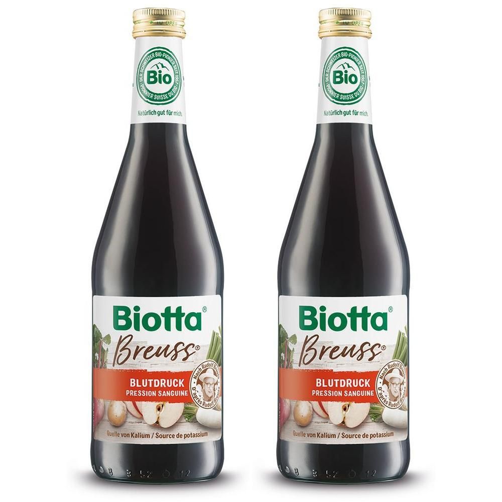 Zwei Flaschen Biotta® Breuss Blutdruck Bio-Saft mit Etiketten, die Rote Bete, Äpfel und Kartoffeln zeigen.