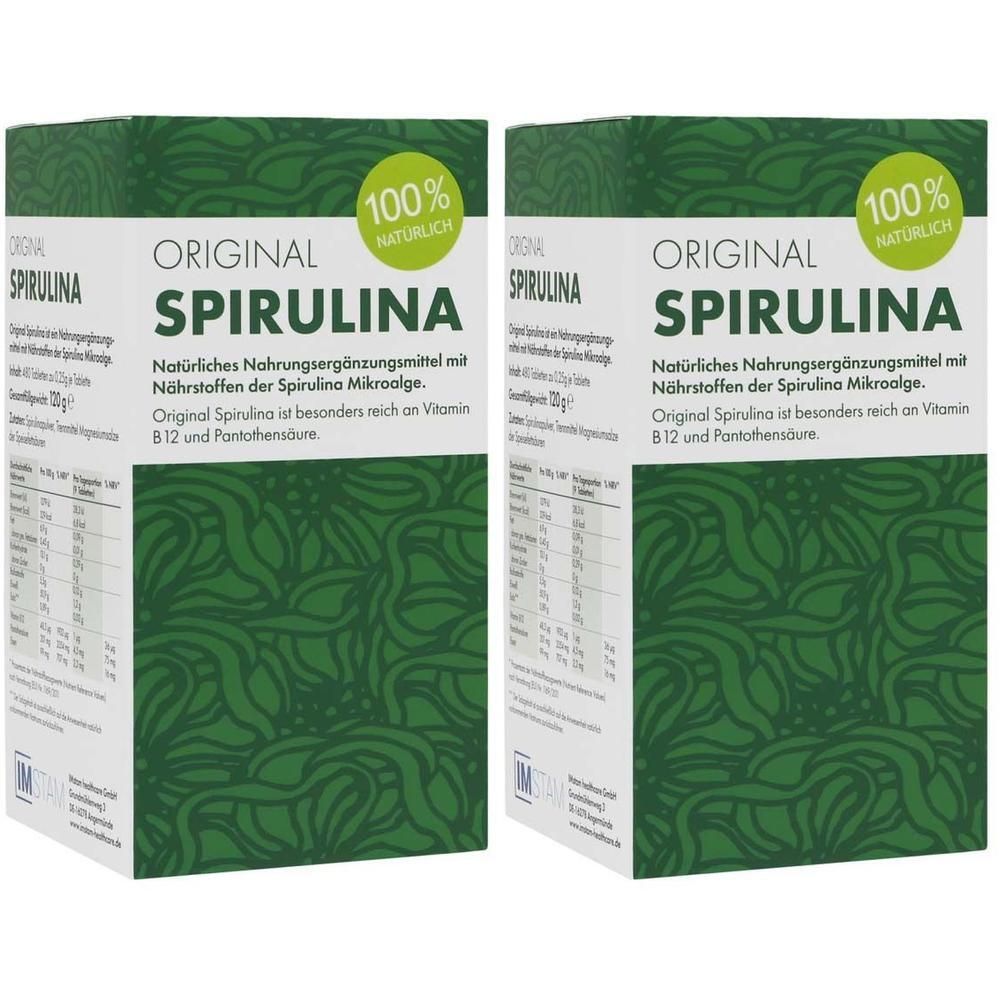 Zwei grüne Kartons mit "ORIGINAL SPIRULINA" Aufschrift. 100% natürlich. Text und grüne Muster.