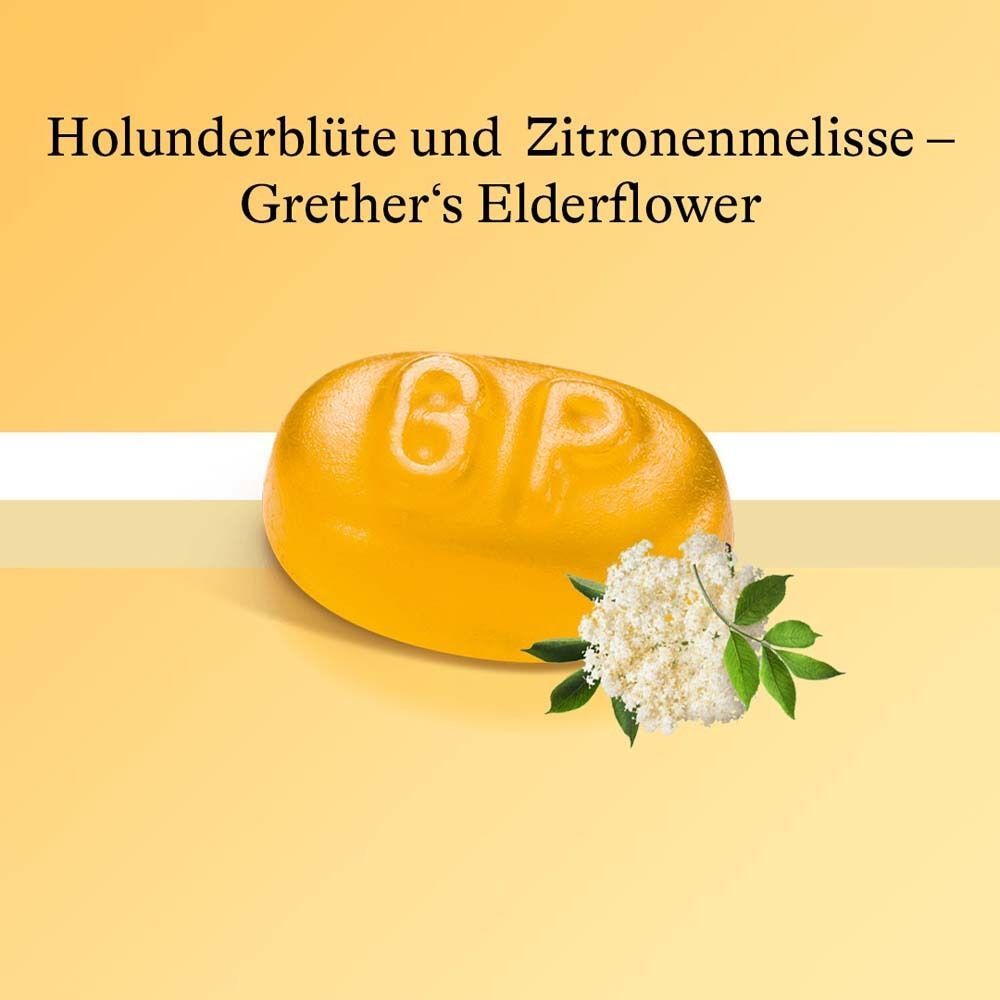 Gelbe Pastille mit Aufschrift 'GTP'. Daneben Holunderblüten. Text: Holunderblüte und Zitronenmelisse - Grether's Elderflower.