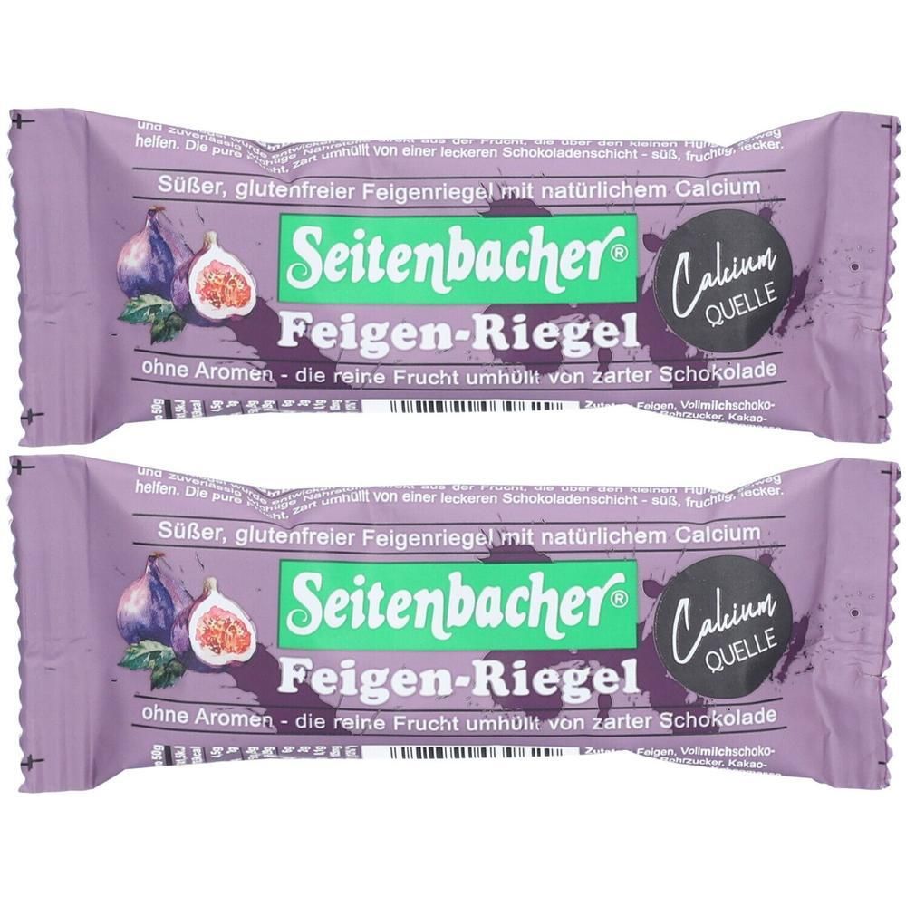 Zwei Feigen-Riegel in lila Verpackung. Aufdruck: Seitenbacher Feigen-Riegel, Calcium Quelle. Abbildung von Feigen.