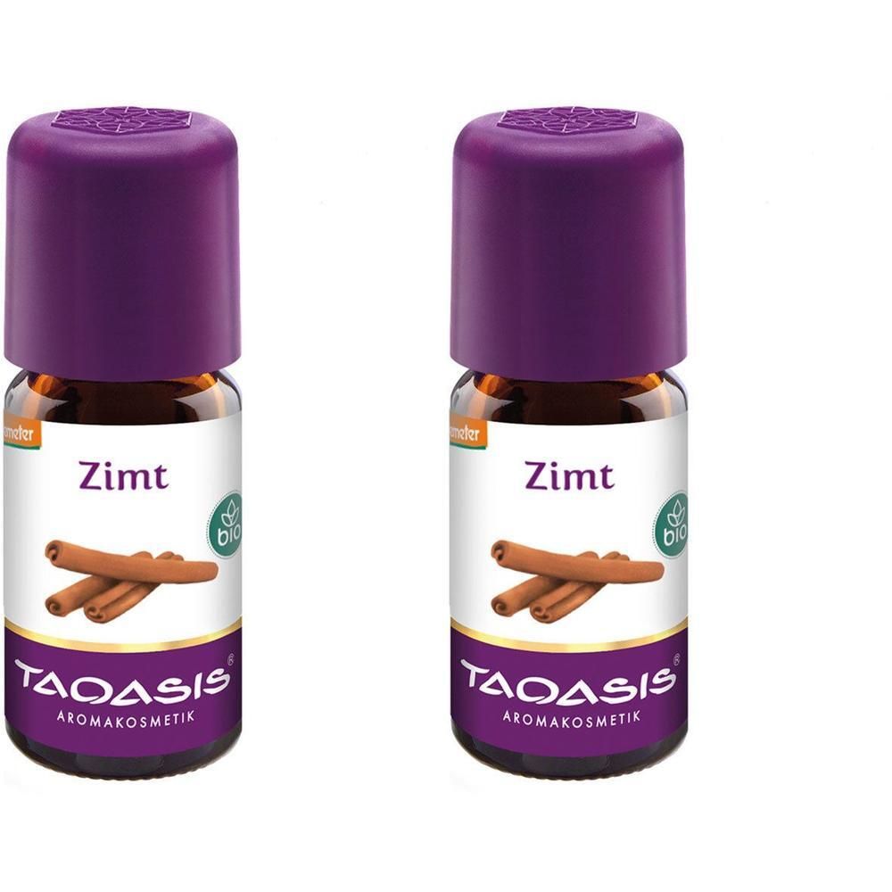 Zwei Flaschen Zimtöl. Braune Glasflaschen mit lila Deckel. Aufschrift Zimt, Bio-Siegel und TAOASIS Aromakosmetik.