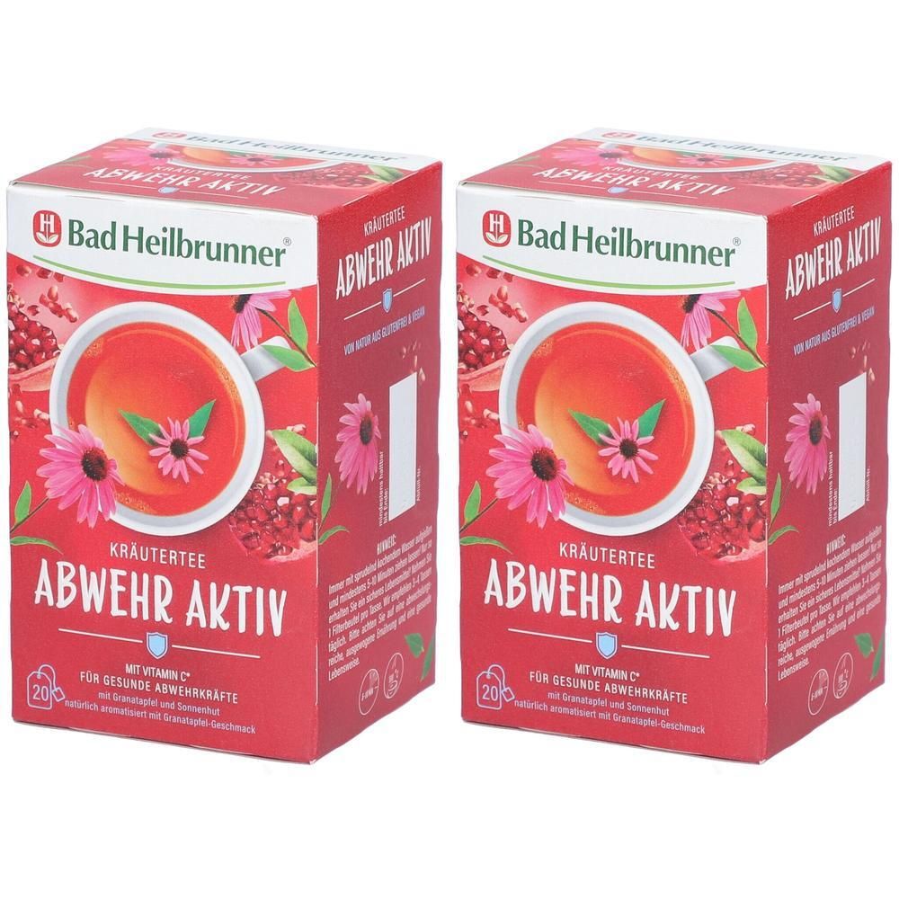 Zwei rote Kartons mit Kräutertee. Aufdruck: Bad Heilbrunner, ABWEHR AKTIV, Kräutertee, mit Vitamin C. Abbildung einer Tasse Tee mit Blüte.
