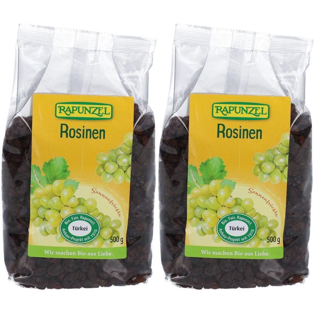 Zwei Beutel Rosinen. Auf gelbem Etikett steht "RAPUNZEL Rosinen". Darunter Abbildung von Trauben. Aufschrift: "500g".