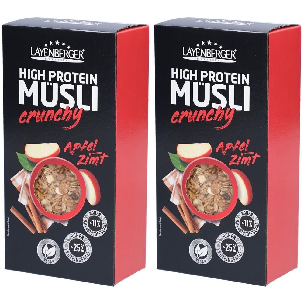 Zwei Kartons Layenberger High Protein Müsli. Schwarze Verpackung mit roter Seite. Aufdruck: Müsli, Apfel-Zimt, hoher Protein- und Ballaststoffgehalt.