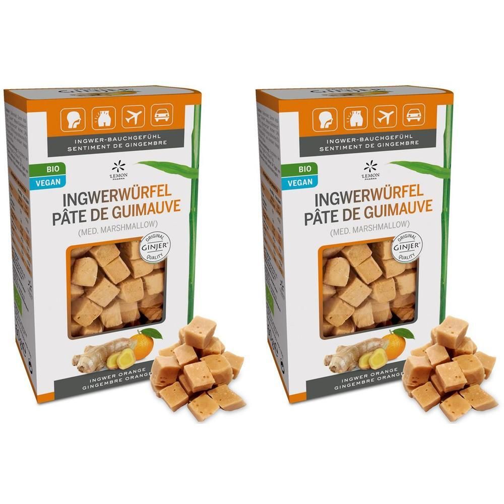 Zwei Kartons mit Ingwerwürfeln. Aufschrift: Ingwerwürfel Pâte de Guimauve. Bio und Vegan. Abgebildet sind Ingwer und Orange.