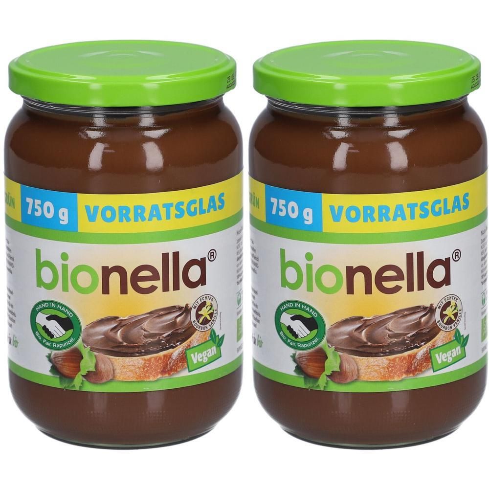 Zwei Gläser Nussnougat-Creme. Aufschrift: bionella, 750g, Vegan. Grüne Deckel und Etiketten.