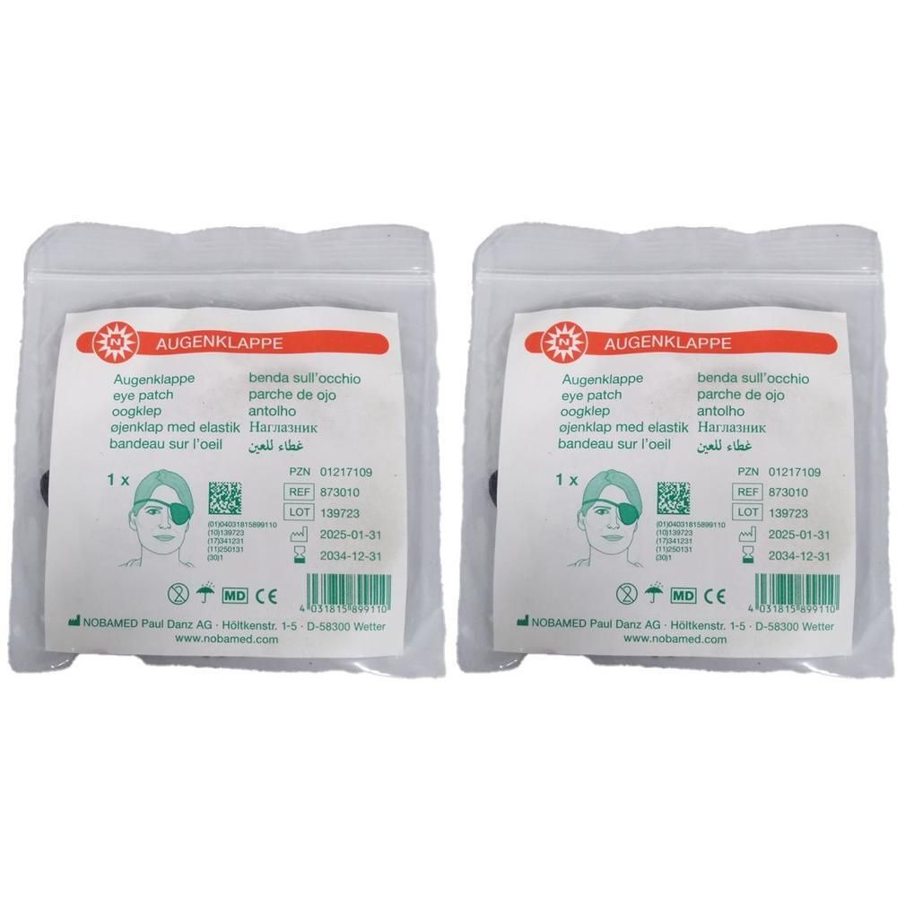 Zwei Augenklappen in Folienverpackung. Aufdruck: Augenklappe, eye patch, 1x, CE-Zeichen. Hersteller: NOBAMED.