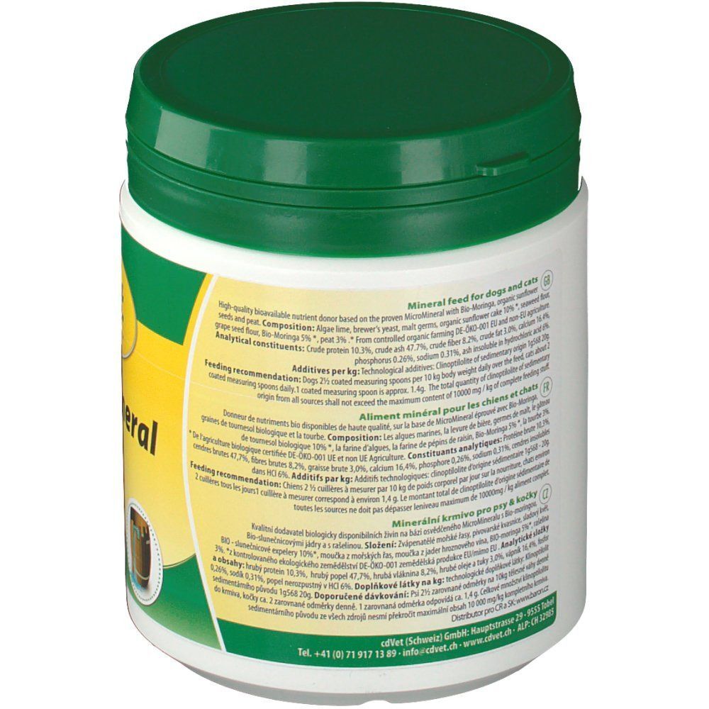 Weiße Dose mit grünem Deckel. Aufschrift "MicroMineral" und Text. Rückseite mit Text in mehreren Sprachen.