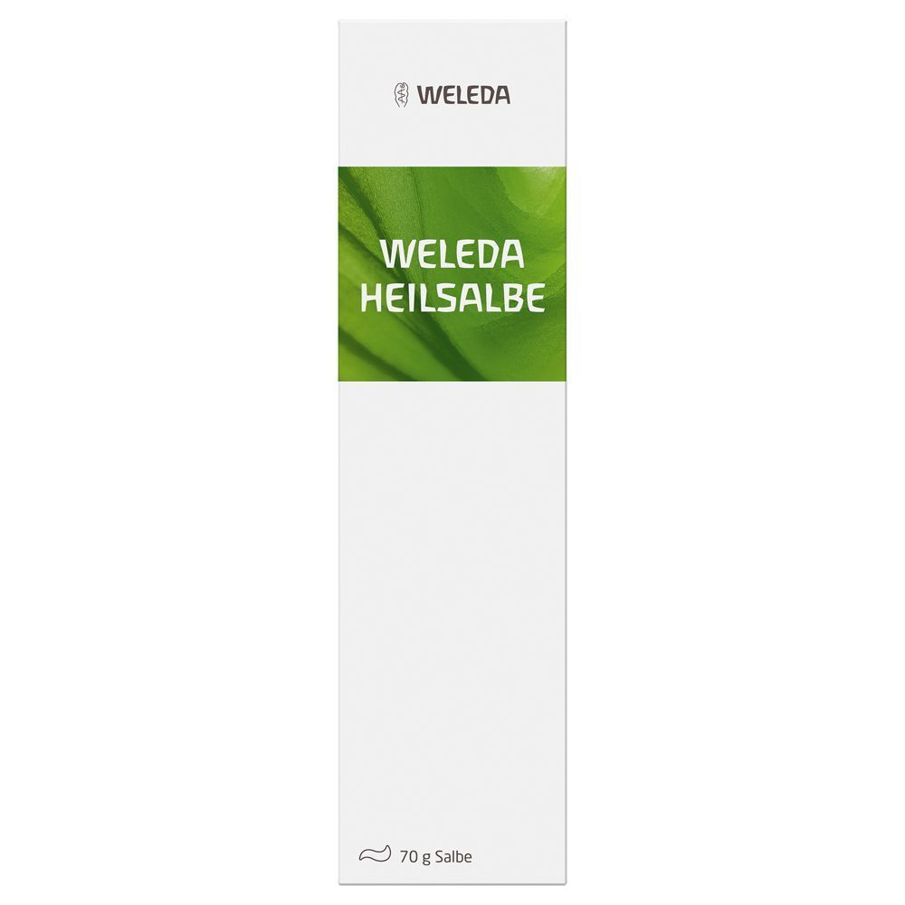 Eine weiße Schachtel mit grünem Streifen. Auf der Schachtel steht "WELEDA HEILSALBE". Am unteren Ende steht "70 g Salbe".