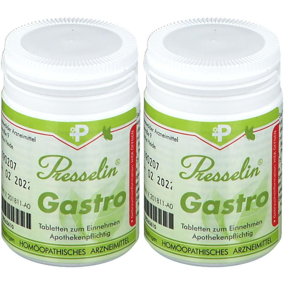 Zwei weiße Behälter mit Presselin Gastro Tabletten, homöopathisches Arzneimittel.