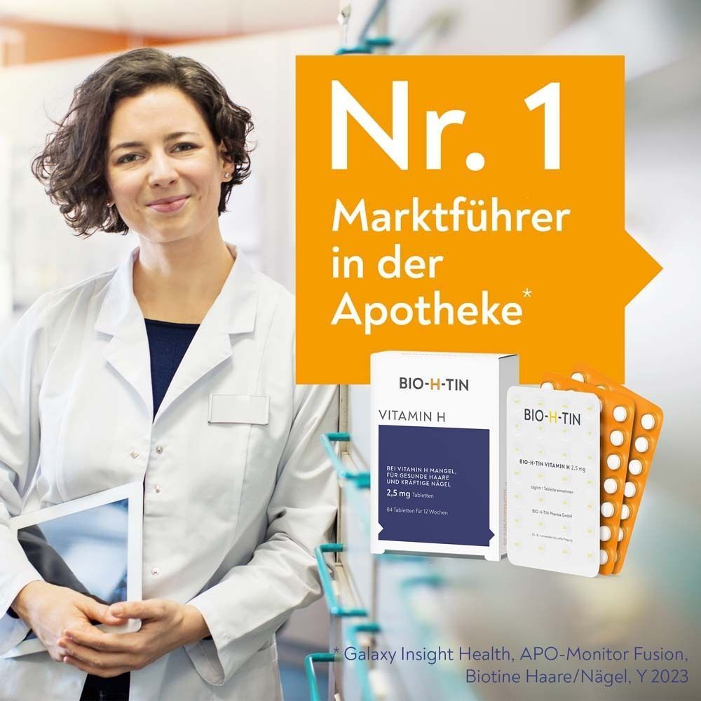 Frau in Apothekerkittel mit Tablet, daneben BIO-H-TIN Vitamin H Packung und Blister.