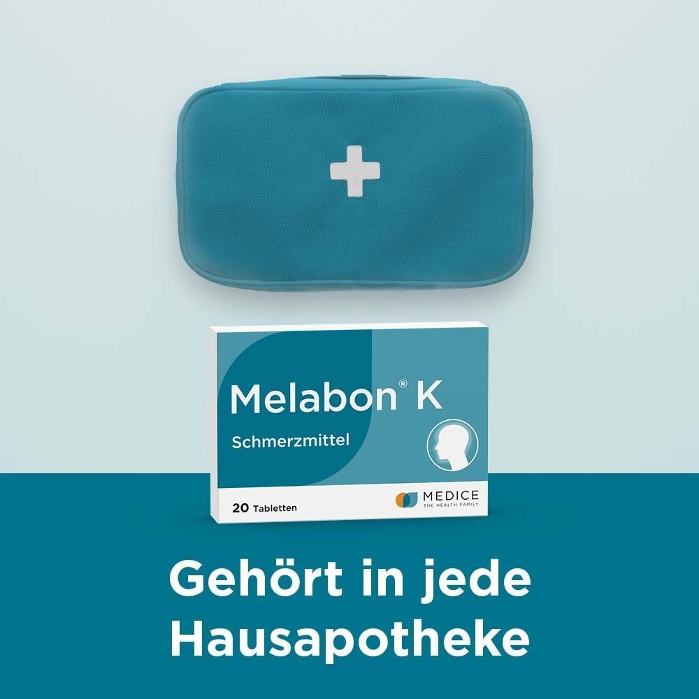 Melabon K Schmerzmittel Packung neben einem Erste-Hilfe-Set.