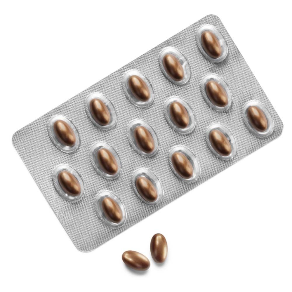 Blisterpackung mit 15 braunen Weichkapseln und zwei Kapseln daneben.