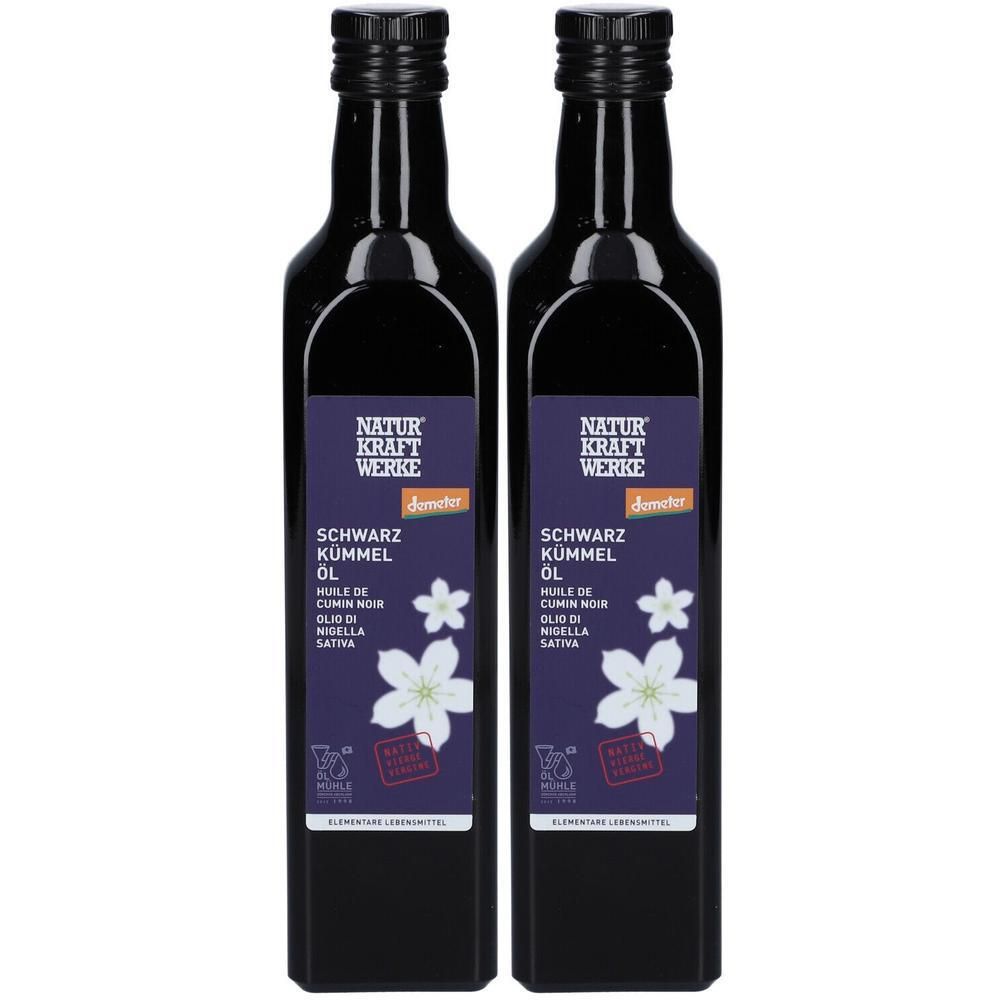 Zwei schwarze Glasflaschen mit NATUR KRAFT WERKE Schwarzkümmelöl, Demeter-Siegel und weißen Blüten.