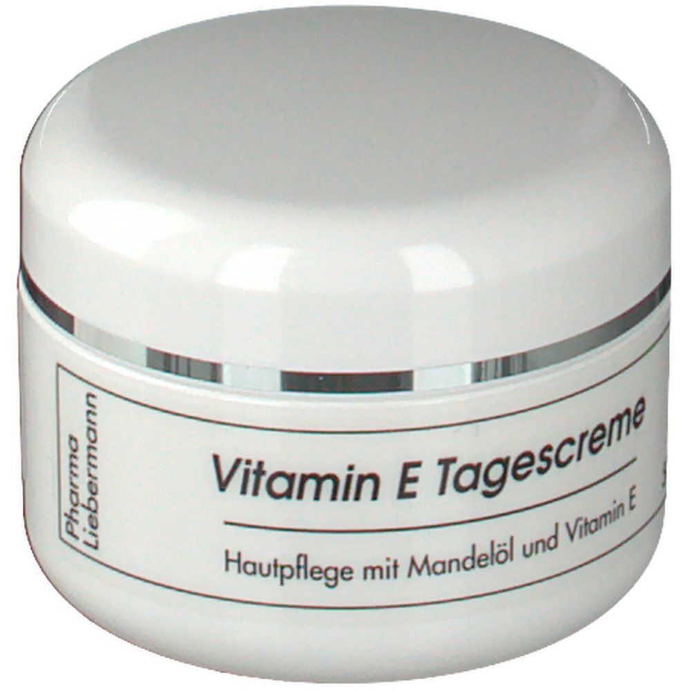 Ein weißer Tiegel Vitamin E Tagescreme mit silbernem Rand, beschriftet mit 'Pharma Liebermann'.
