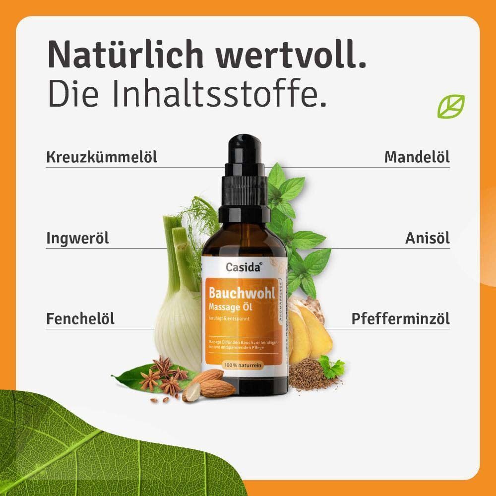 Casida Bauchwohl Massage Öl Flasche umgeben von Zutaten wie Fenchel, Sternanis und Mandeln.