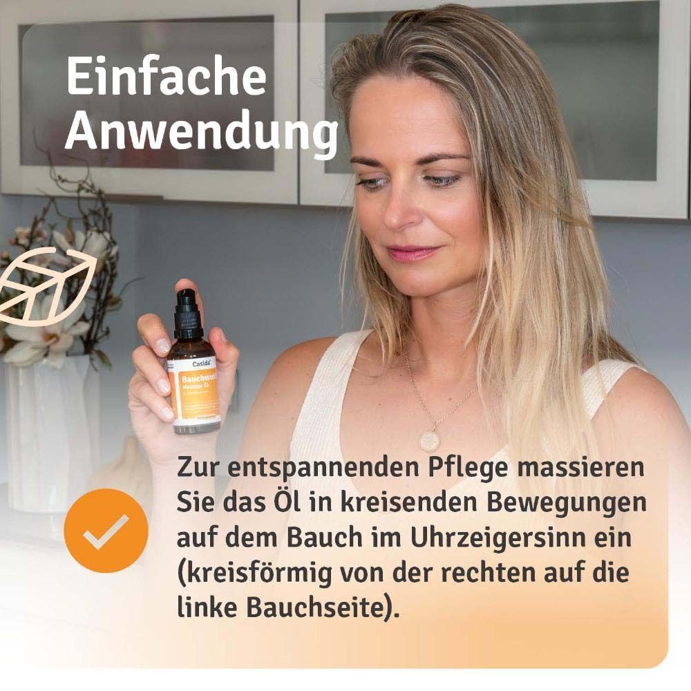 Frau hält Casida Bauchwohl Massage Öl Flasche, Anwendungshinweis für Bauchmassage.