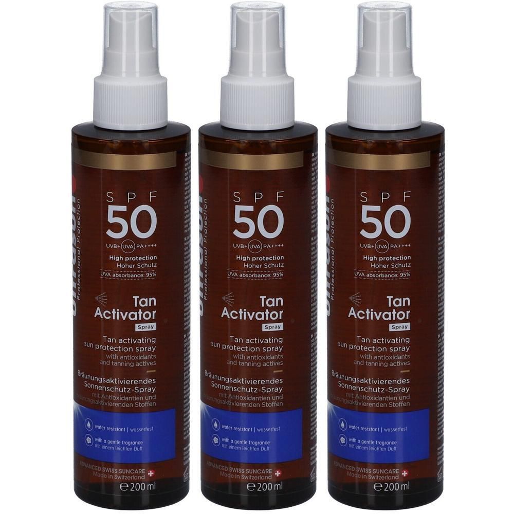Drei Flaschen Tan Activator Spray SPF 50 mit braunen Etiketten und weißen Sprühköpfen.