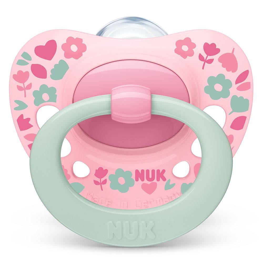 NUK Signature Schnuller 18-36 Monate in Rosa mit Blumenmuster.