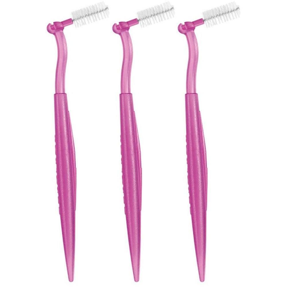 Drei pinke Interdentalbürsten mit abgewinkeltem Kopf und weißen Borsten.