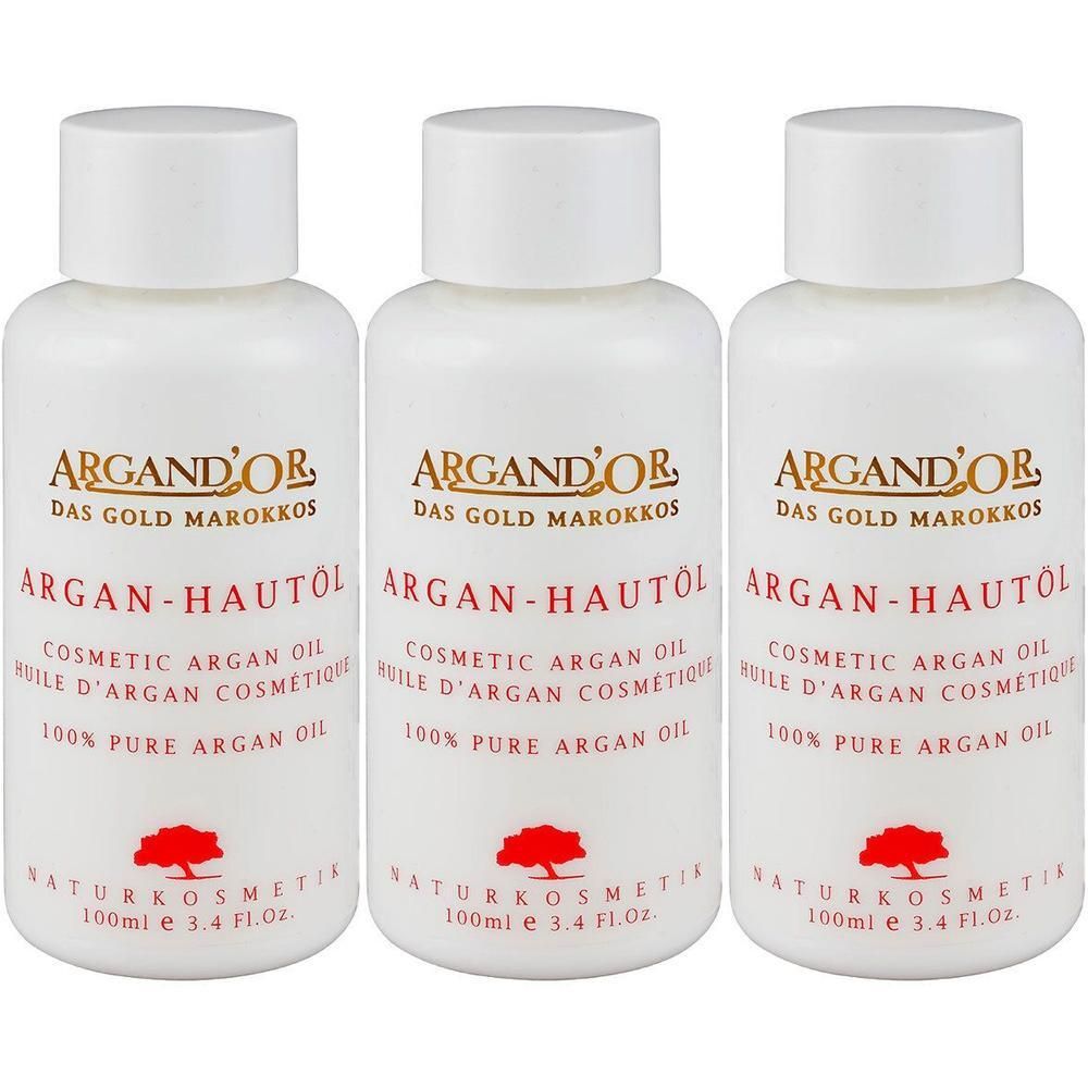 Drei weiße Flaschen mit Arganöl, beschriftet mit 'ARGAND'OR ARGAN-HAUTÖL'.