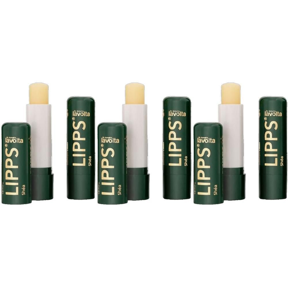 Drei LAVOLTA LIPPS® Shea Lippenbalsam-Stifte mit dunkelgrünen Kappen.