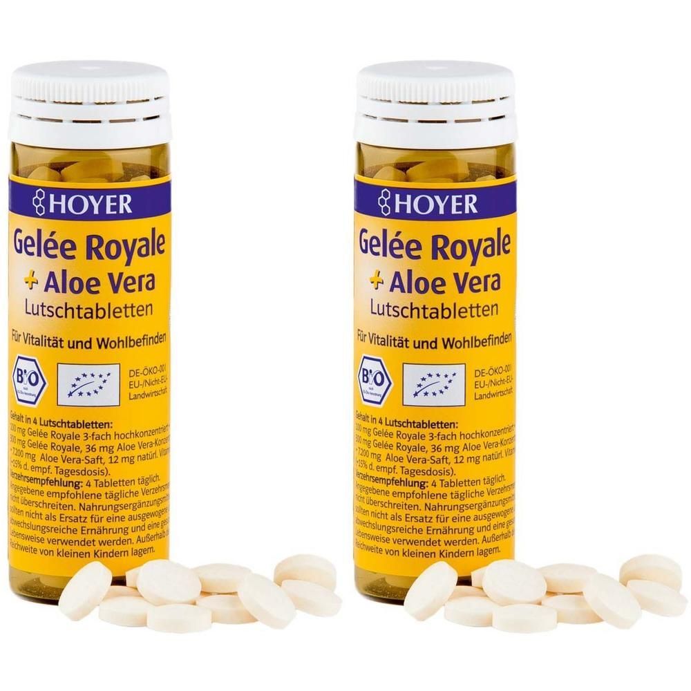 Zwei Flaschen HOYER Gelee Royale + Aloe Vera Lutschtabletten mit herausgefallenen Tabletten.