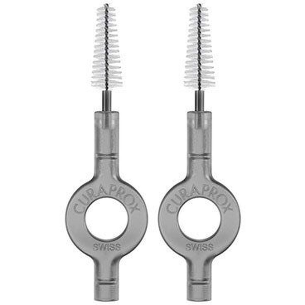 Zwei Curaprox Interdentalbürsten mit transparentem Griff und weißem Bürstenkopf.