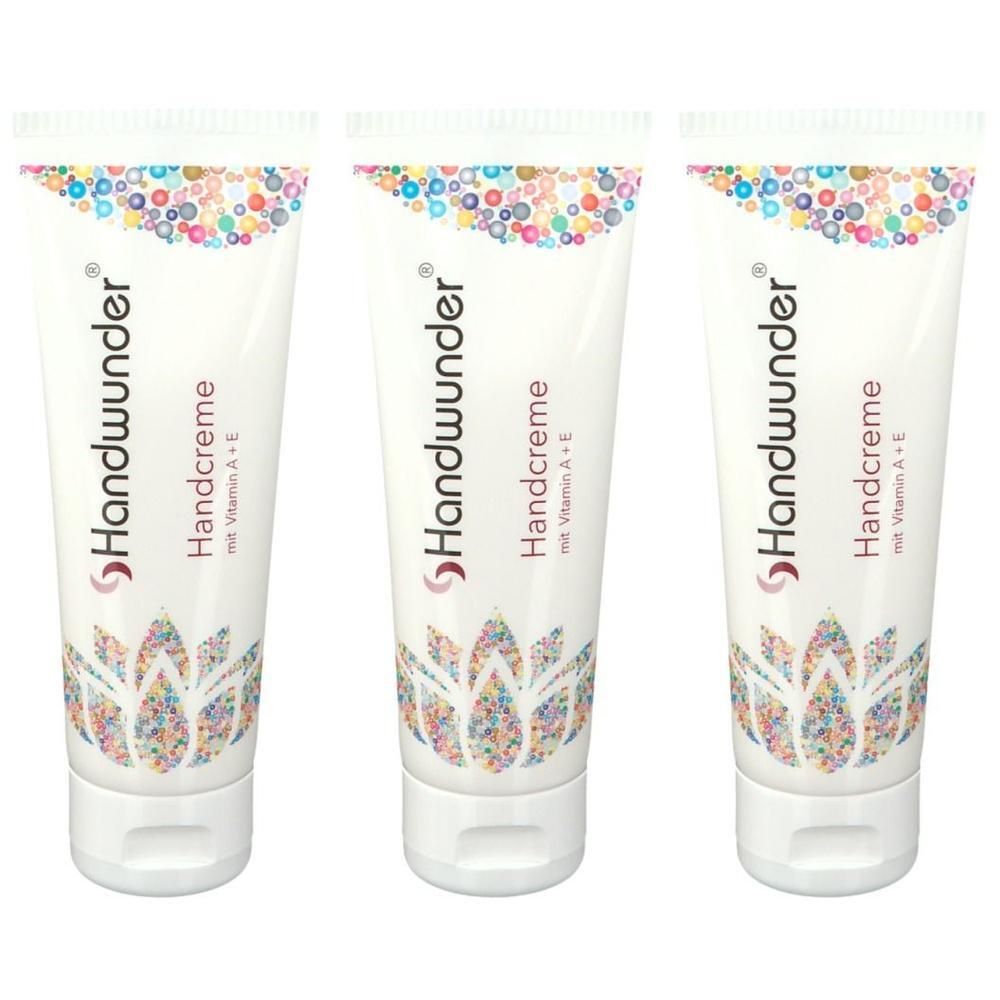 Drei Tuben Handwunder Handcreme mit Vitamin A+E, weiße Verpackung mit buntem Blumenmuster.