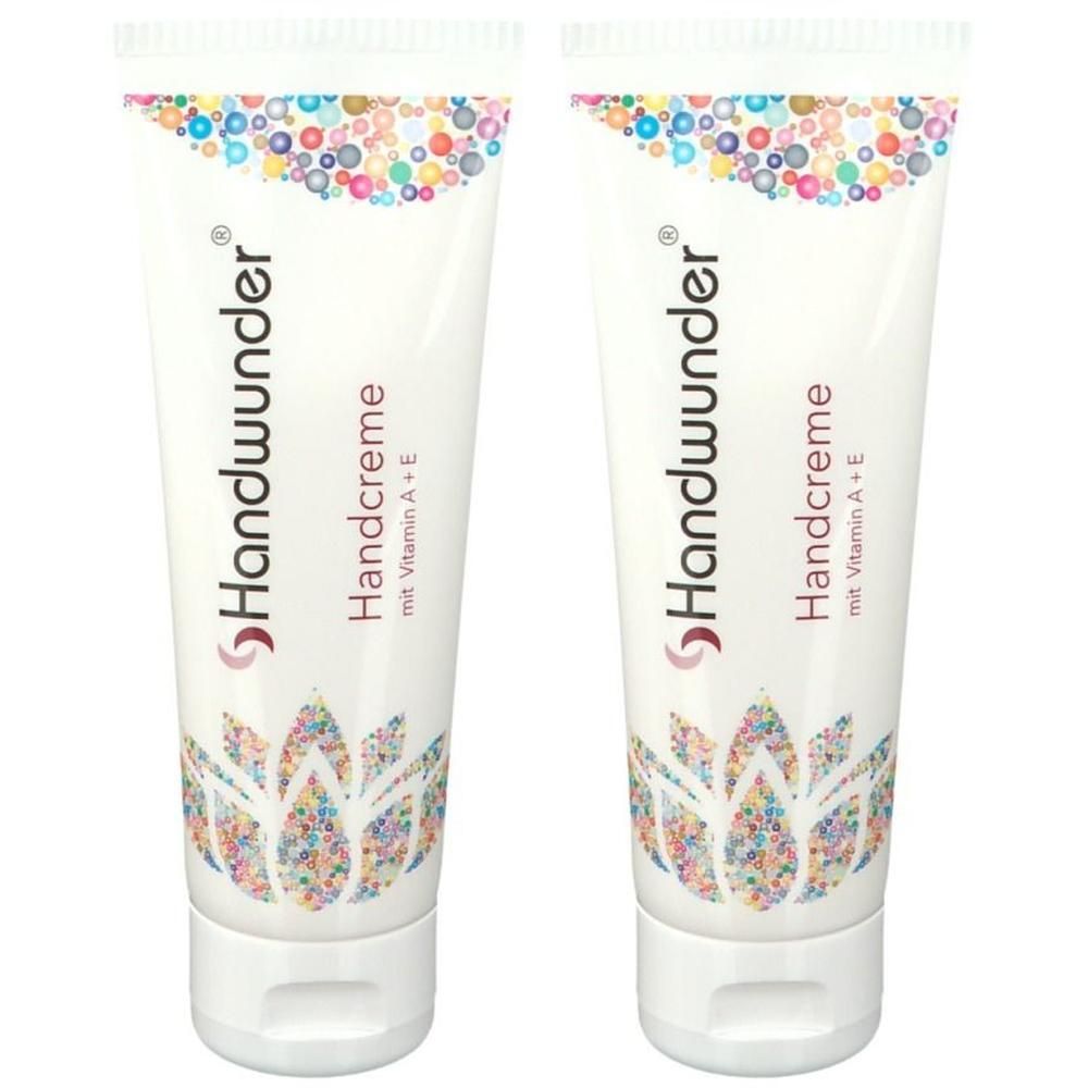Zwei weiße Tuben Handcreme mit Vitamin A+E und Lotus-Blumen-Design.
