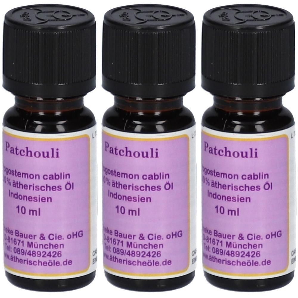 Drei 10ml Flaschen Patchouli ätherisches Öl mit schwarzen Schraubverschlüssen und lila Etiketten.