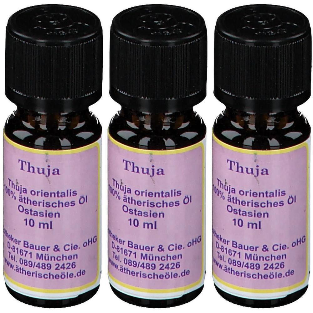 Drei Flaschen ätherisches Thujaöl, jeweils 10 ml, mit schwarzen Schraubverschlüssen und lila Etiketten.