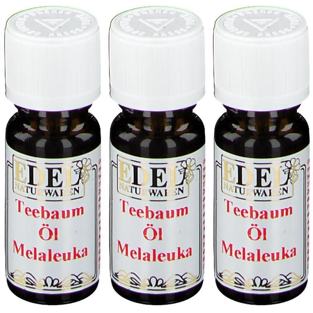 Drei Flaschen Teebaumöl Melaleuka mit weißen Verschlüssen und Etiketten.