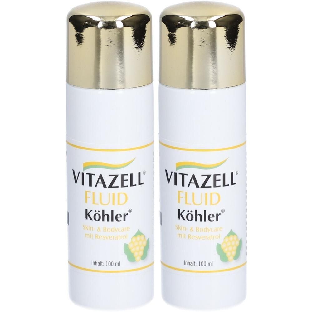 Zwei weiße Flaschen mit goldenen Kappen, beschriftet mit Vitazell Fluid Köhler.
