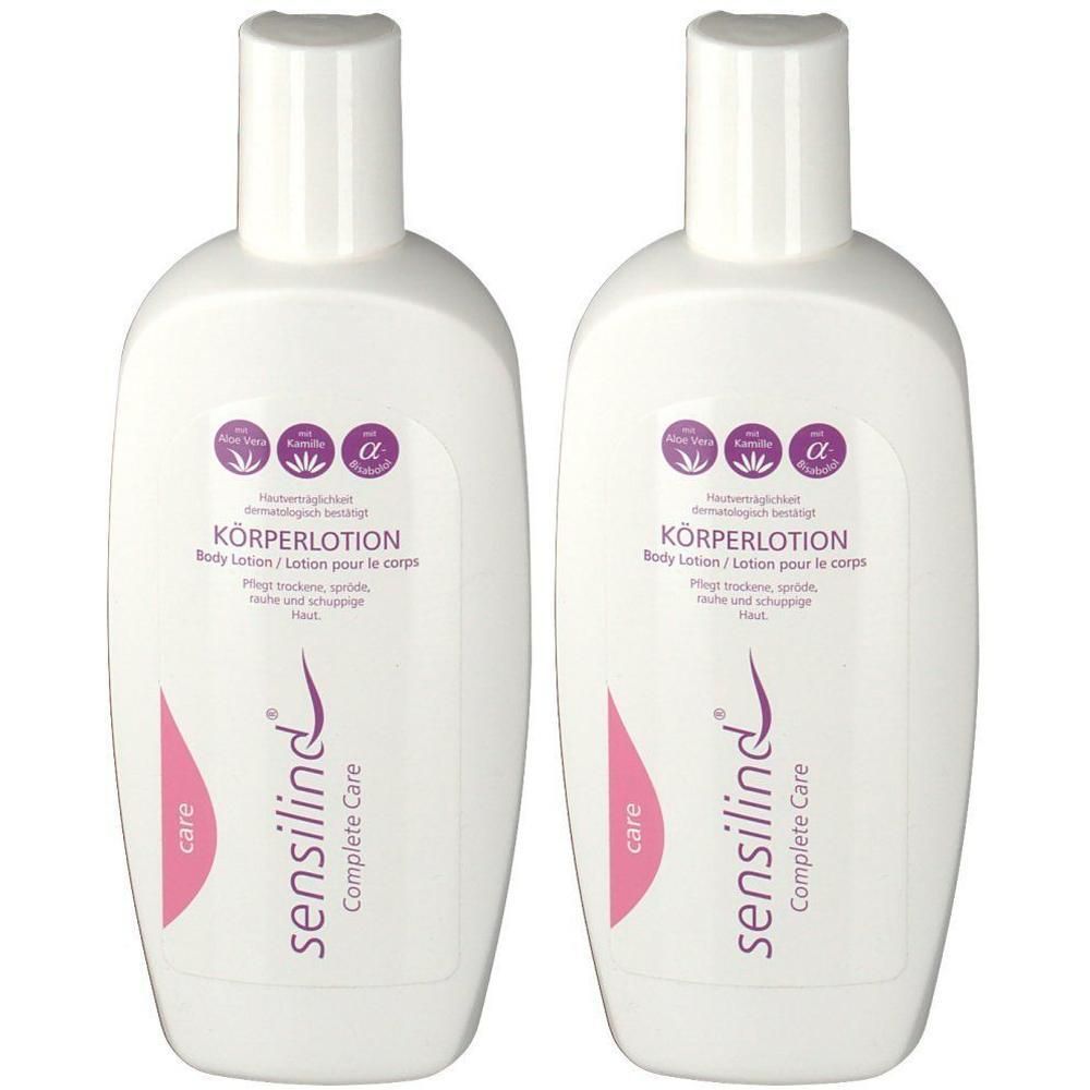Zwei weiße Flaschen sensilind Körperlotion mit rosa und lila Etiketten.