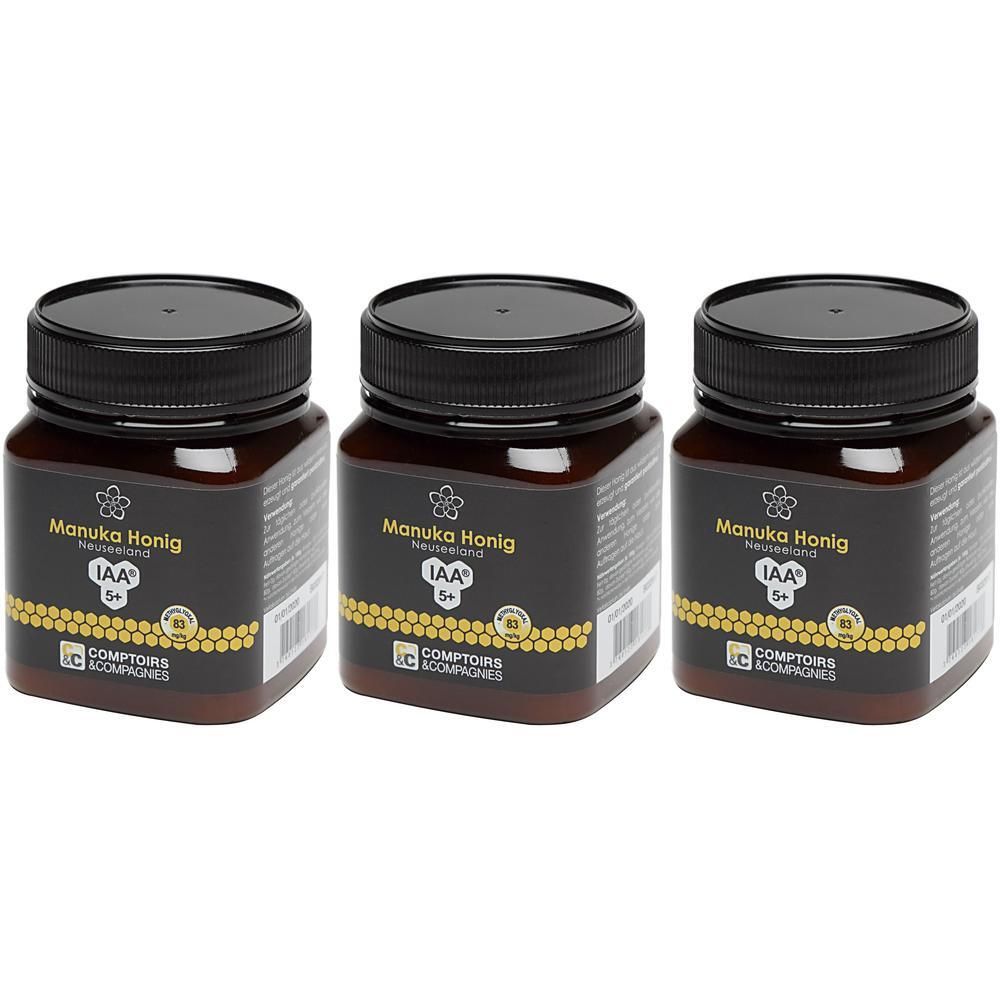 Drei Gläser Manuka Honig MGO 80 IAA® 5+ mit schwarzen Deckeln.