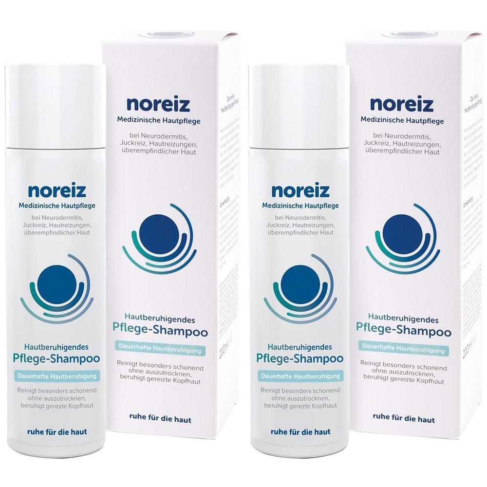 Zwei Flaschen und Kartons noreiz Hautberuhigendes Pflege-Shampoo mit Logo und Text.