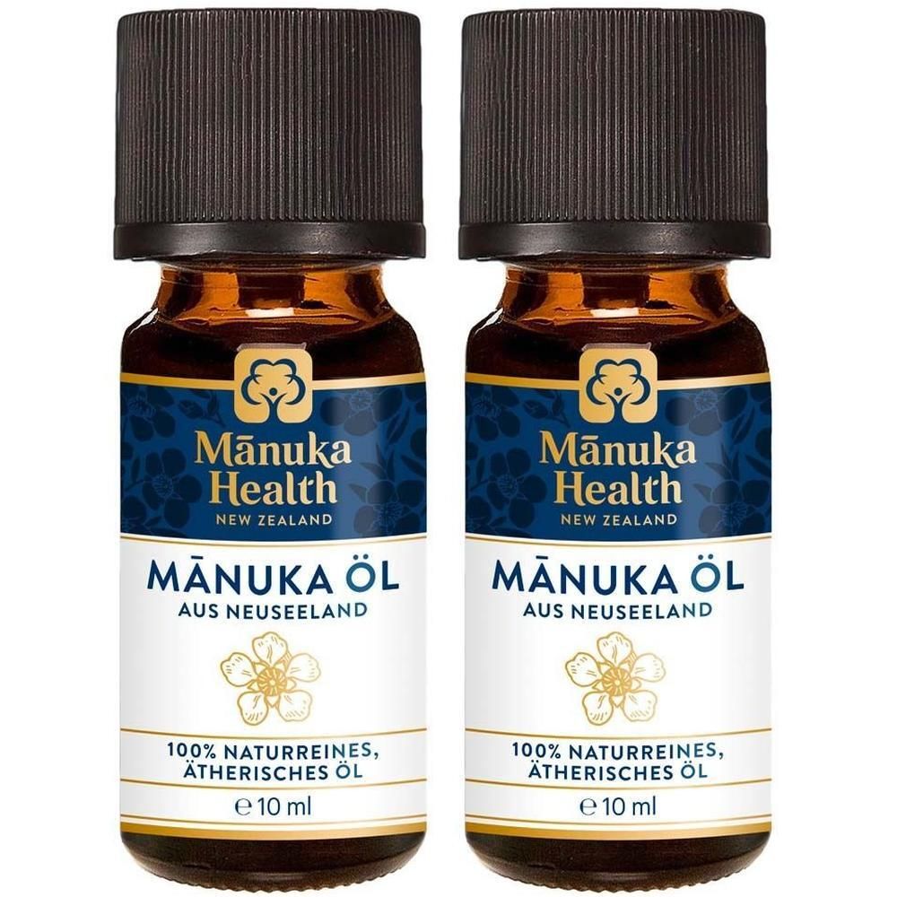 Zwei Flaschen Manuka Öl, 10 ml, mit braunem Schraubverschluss und Etikett mit floralem Muster.
