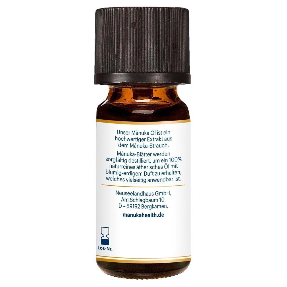 Rückseite einer Flasche Manuka Öl mit Produktbeschreibung und Herstellerinformationen.