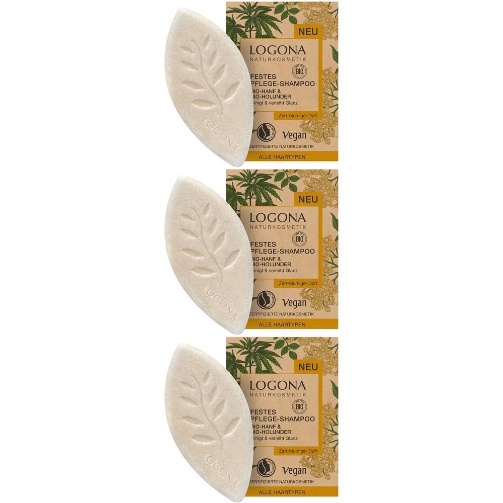 Drei feste feste Pflege-Shampoos in Blattform mit LOGONA Prägung, neben ihren Verpackungen.
