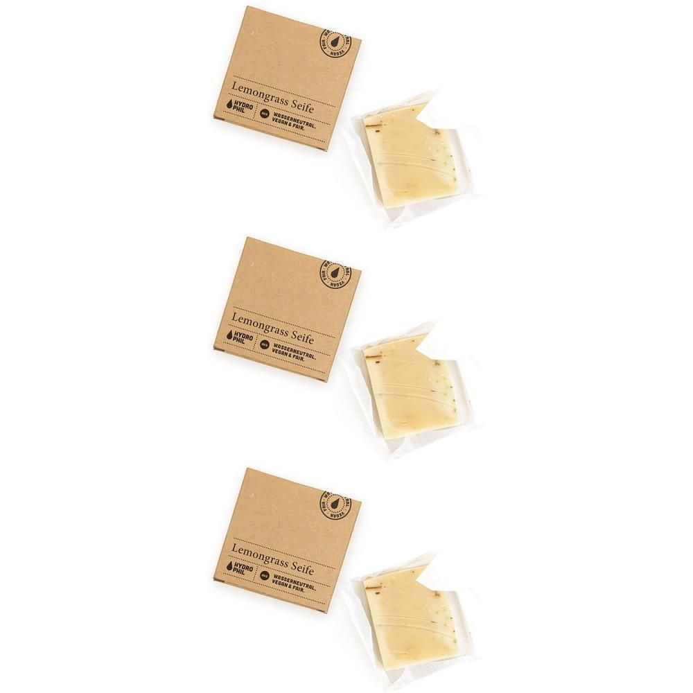 Drei Packungen Lemongrass-Seife, jeweils eine Seife in Klarsichtfolie.