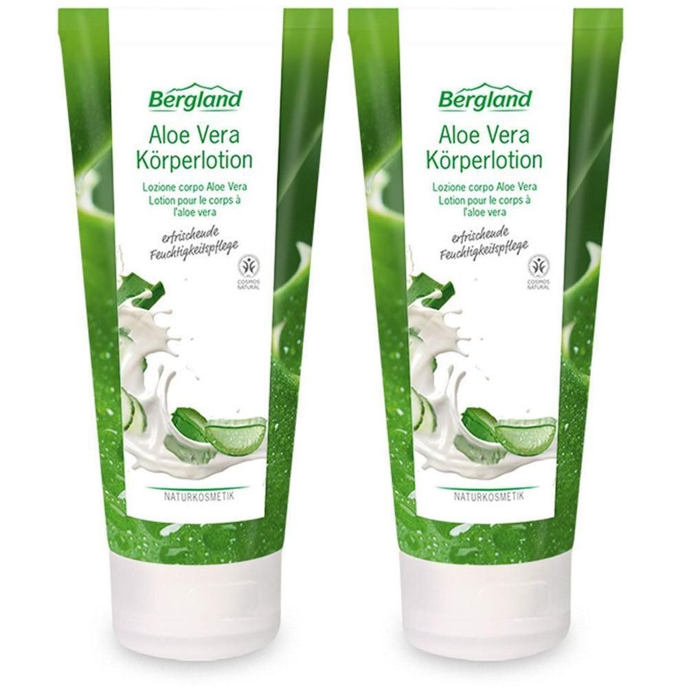 Zwei Tuben Bergland Aloe Vera Körperlotion mit Aloe Vera und Milchspritzern.