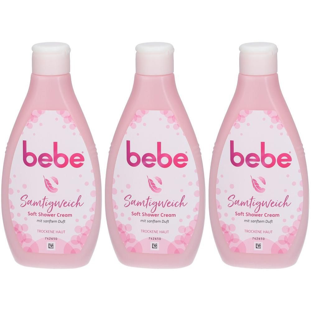Drei Flaschen bebe Samtigweich Soft Shower Cream in Rosa. Etikett mit rosa Schrift und Feder-Symbol.