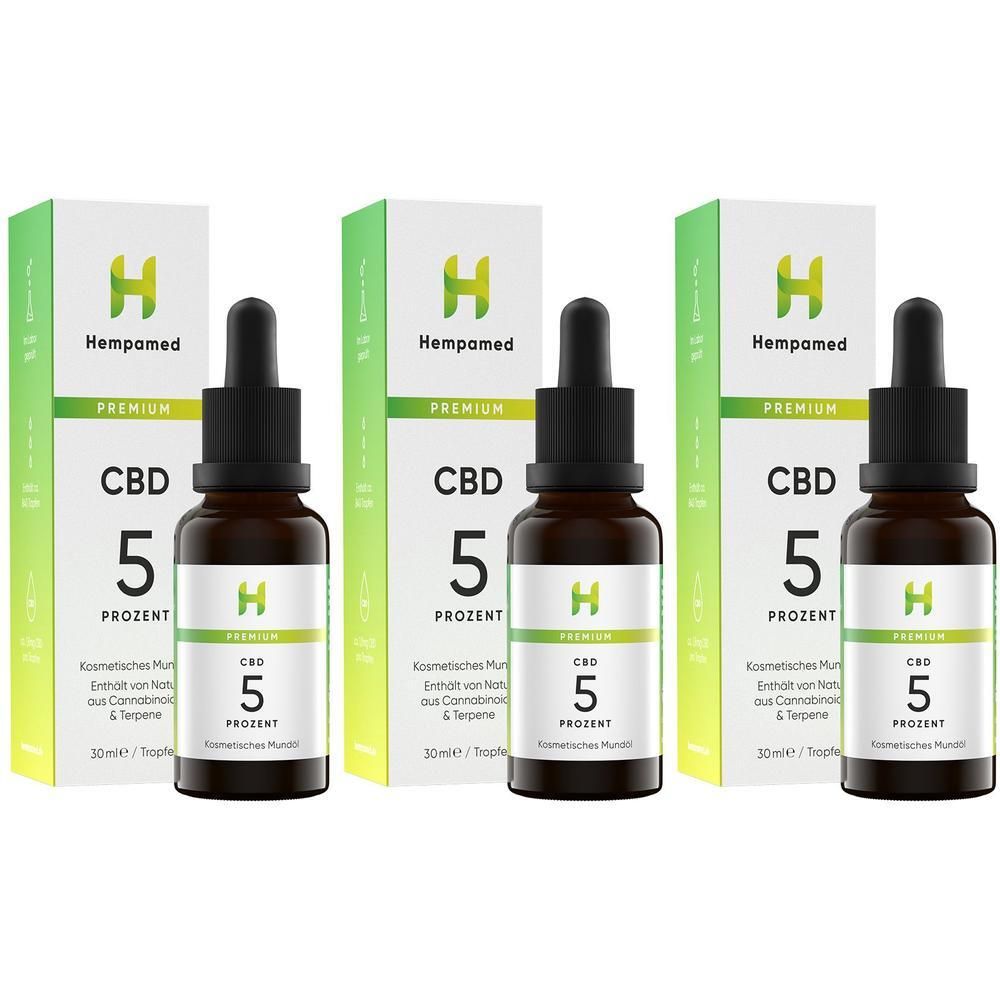 Drei Flaschen Hempamed Premium CBD Öl 5% mit Pipetten und Umverpackungen.