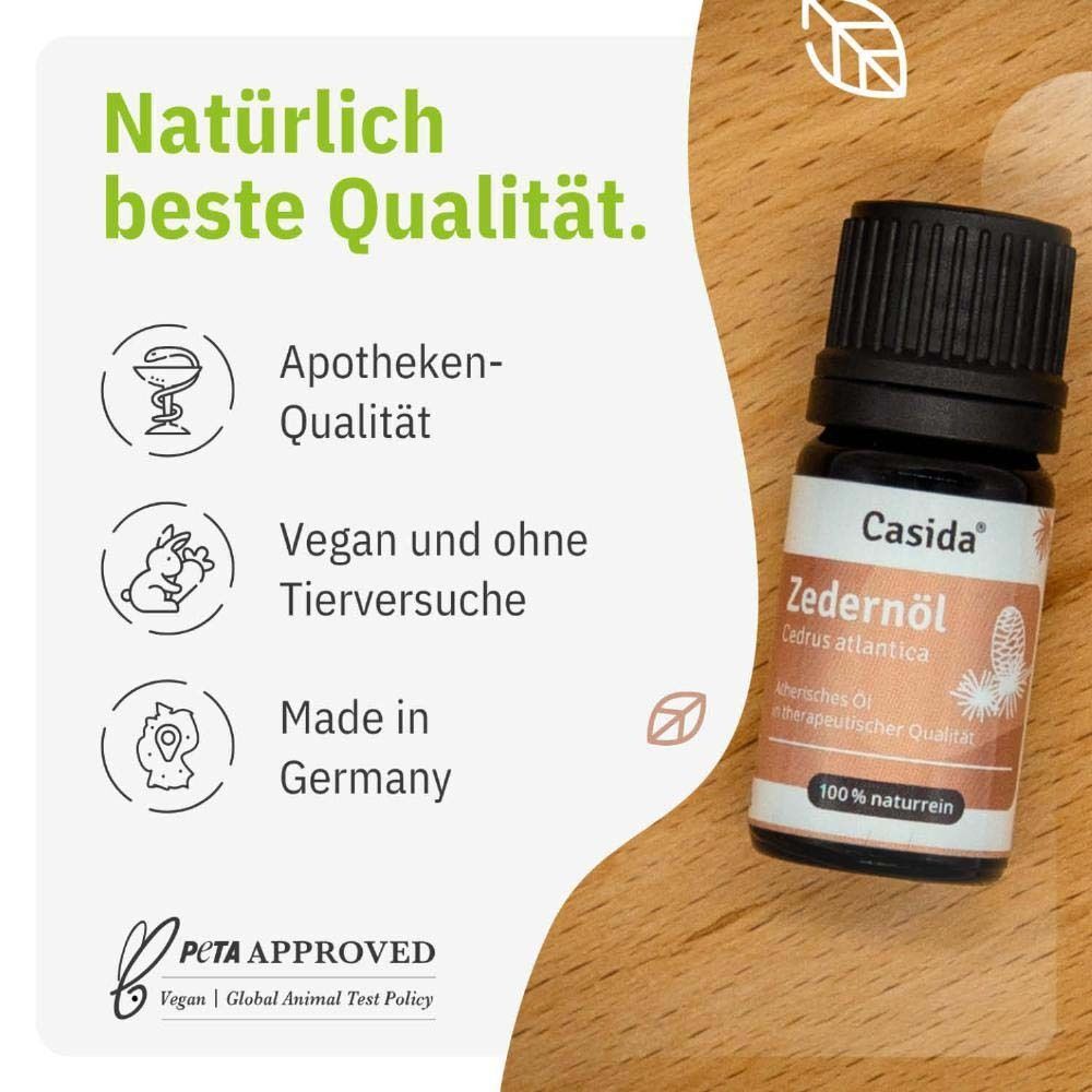 Eine Flasche Casida Zedernöl neben Icons für Apothekenqualität, vegan, tierversuchsfrei und Made in Germany.