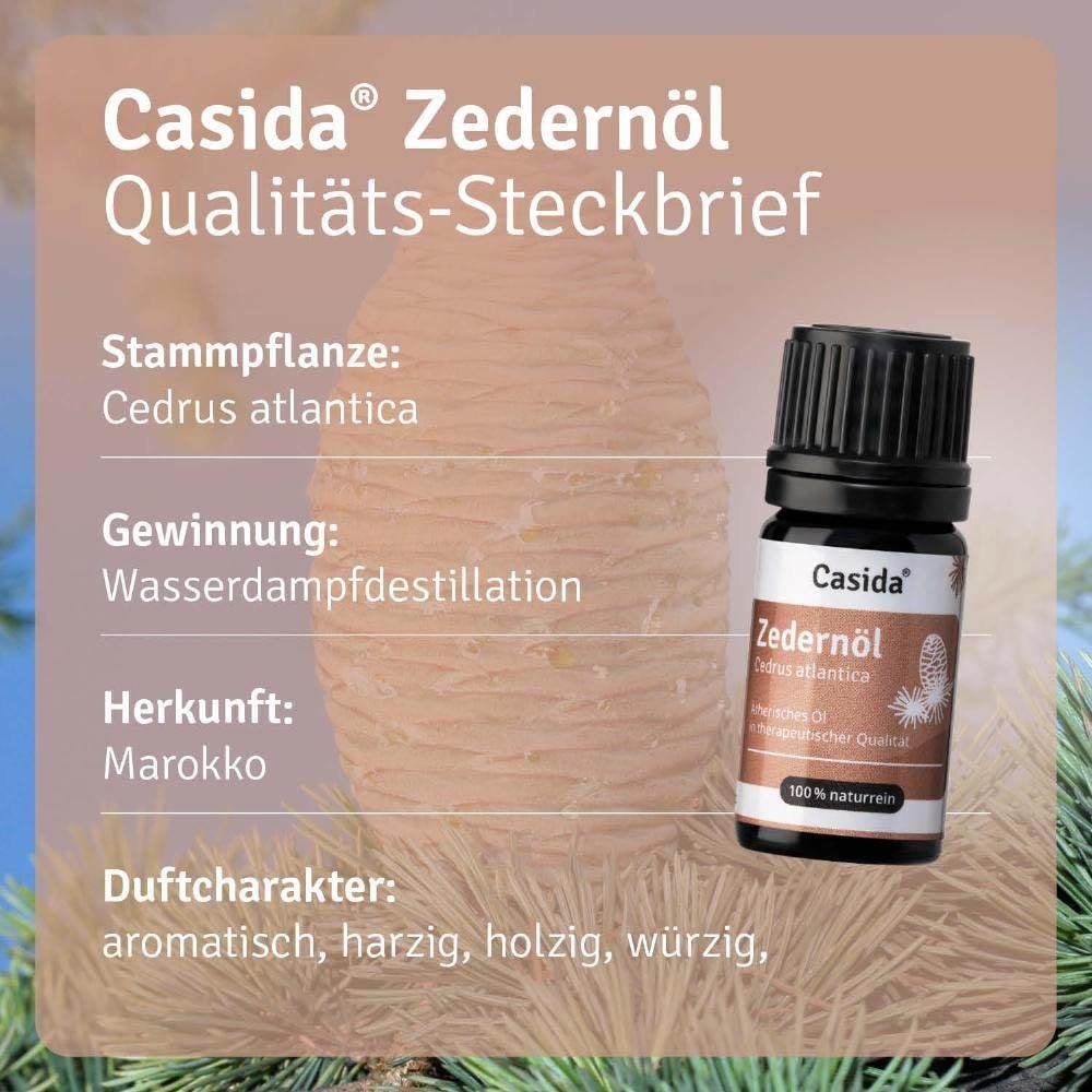 Ein Fläschchen Casida Zedernöl vor einem Hintergrund einer Zederenzapfen-Illustration mit Produktinformationen.