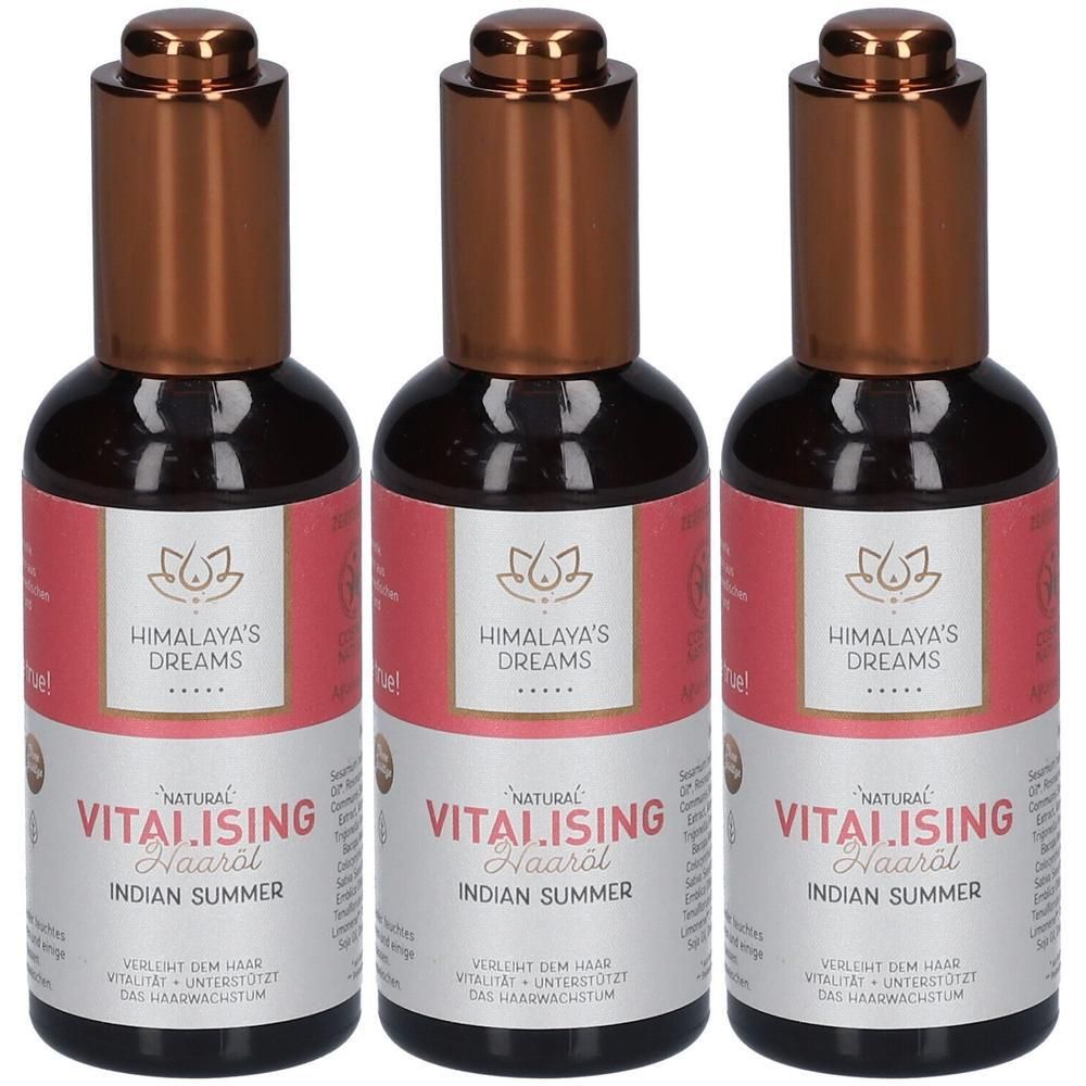 Drei Flaschen Himalaya's Dreams Vitalising Haaröl Indian Summer mit Kupferfarbenen Verschlüssen und Etiketten.