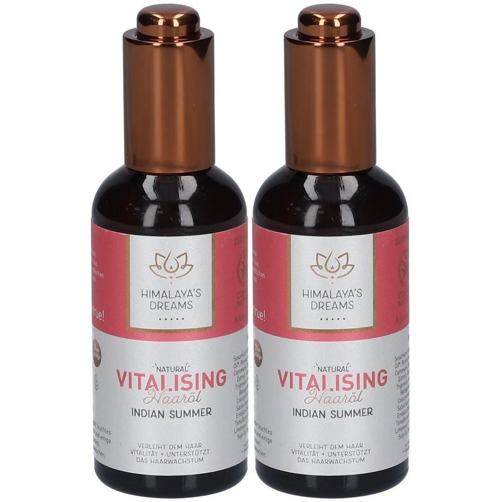 Zwei Flaschen Himalaya's Ayurveda Haaröl Vitalising Indian Summer mit Kupferfarbenen Verschlüssen.