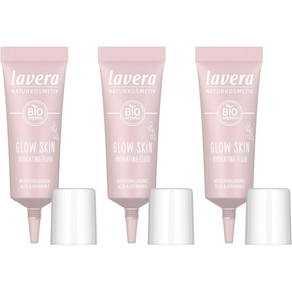 Drei rosa Tuben Lavera Glow Skin Hydrating Fluid mit weißen Kappen.