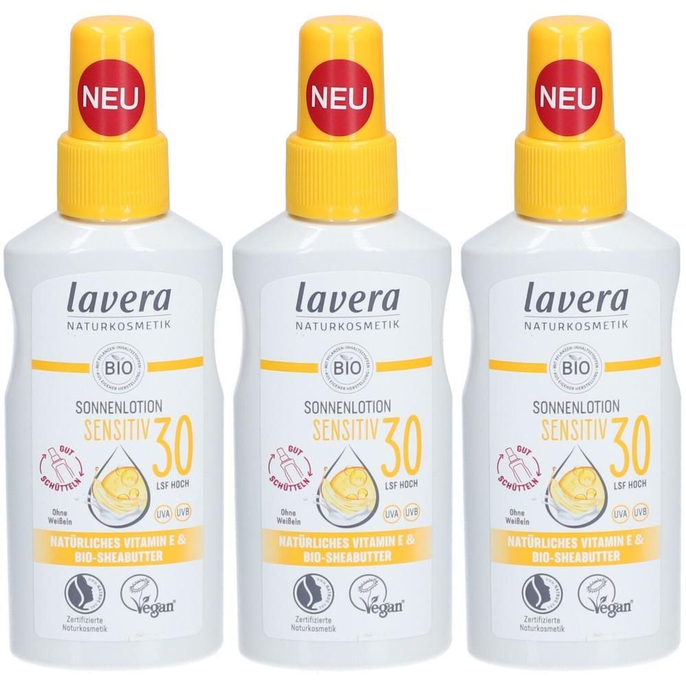 Drei Flaschen Lavera Sonnenlotion Sensitiv LSF 30 mit gelben Sprühköpfen und roten "NEU"-Aufklebern.